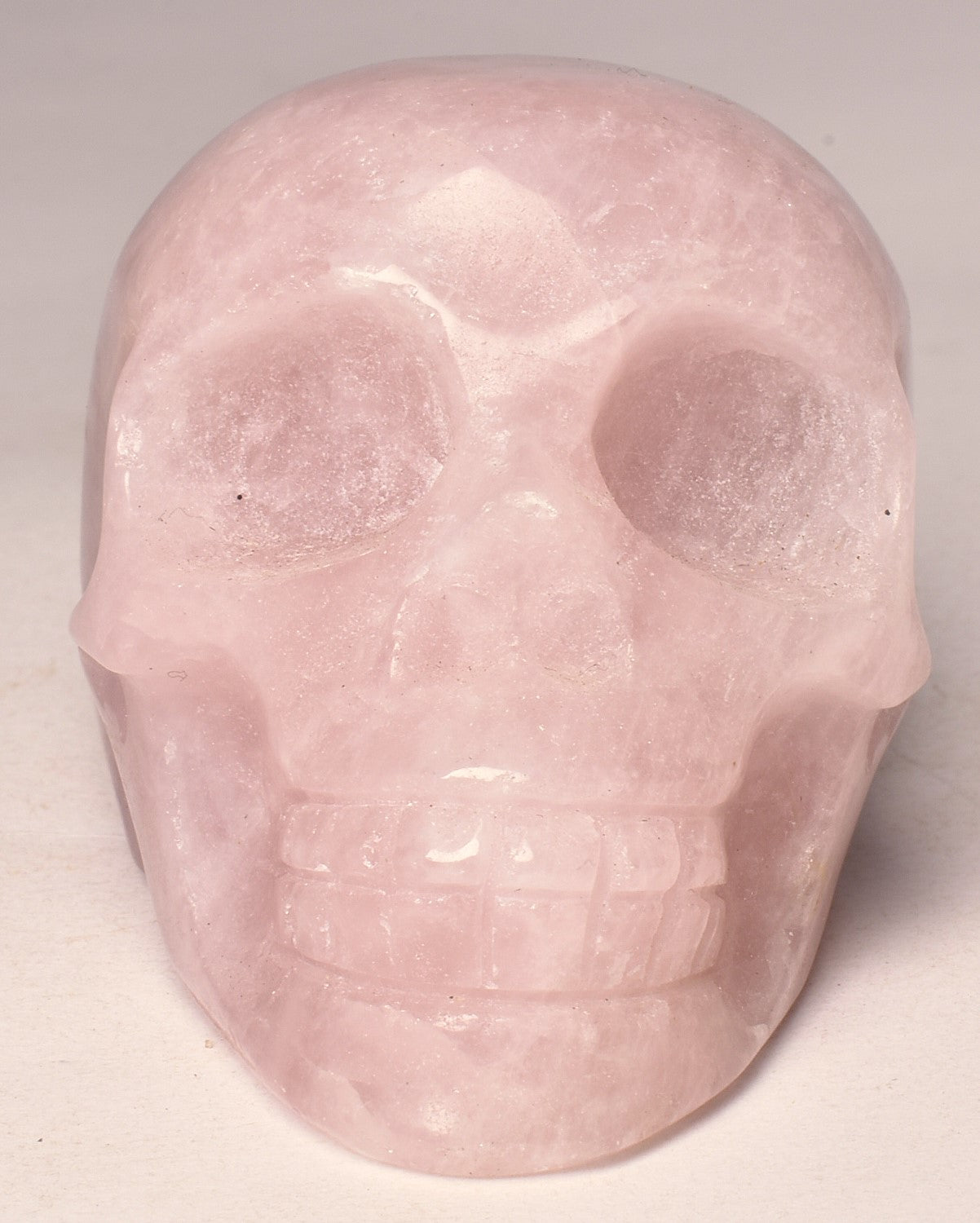 ROSE QUARTZ CRYSTAL CARVED SKULL P672