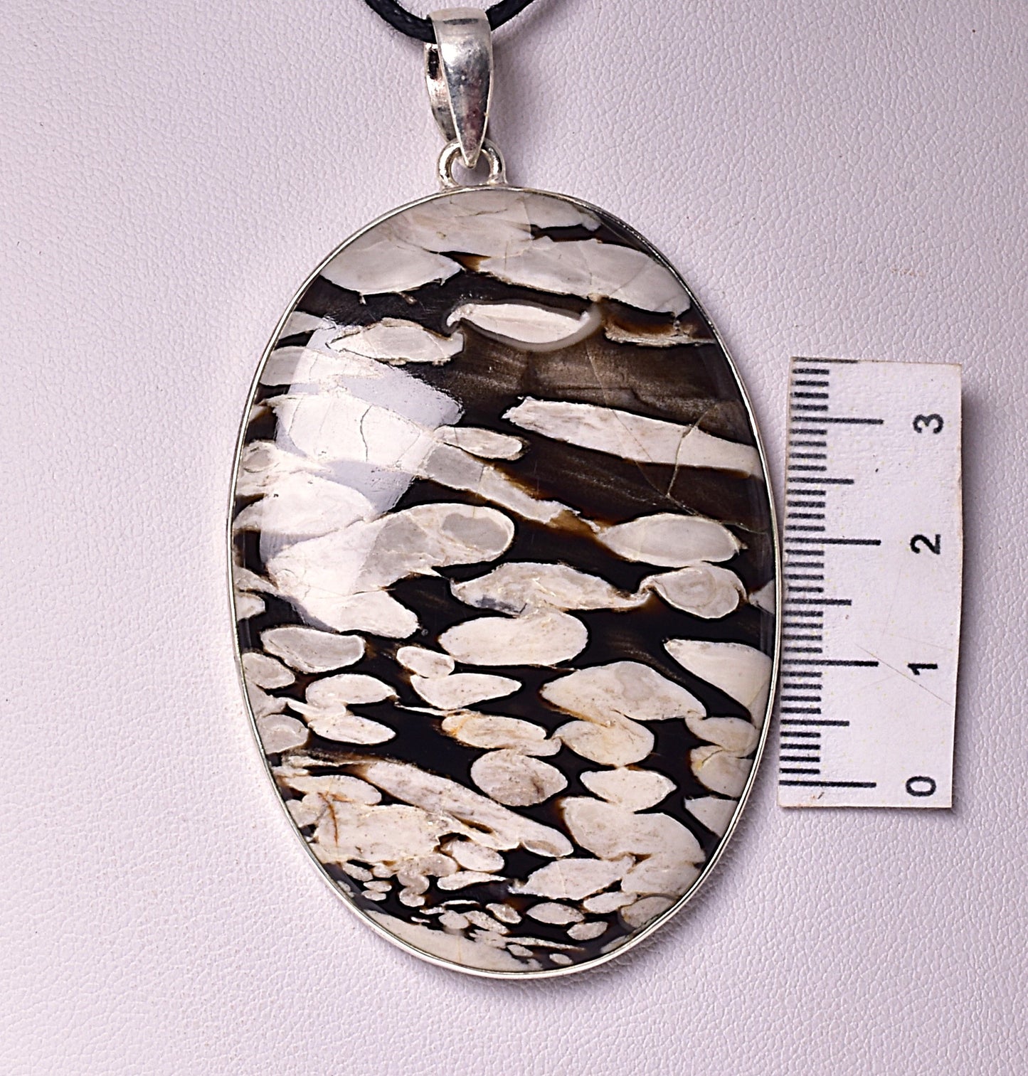 FOSSIL PEANUT WOOD PENDANT, set in STERLING SILVER J84