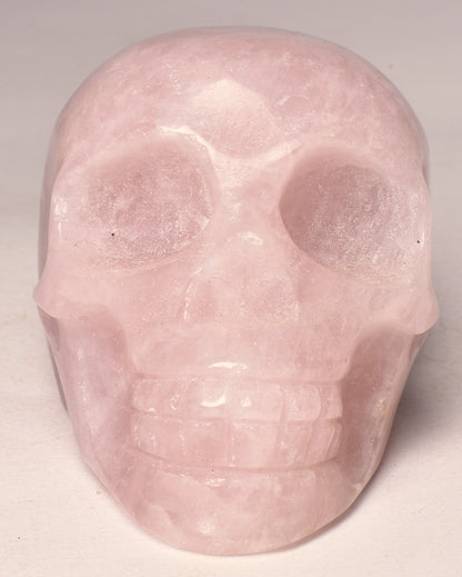 ROSE QUARTZ CRYSTAL CARVED SKULL P672