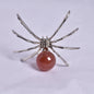 CARNELIAN SPHERE ON METAL SPIDER P369