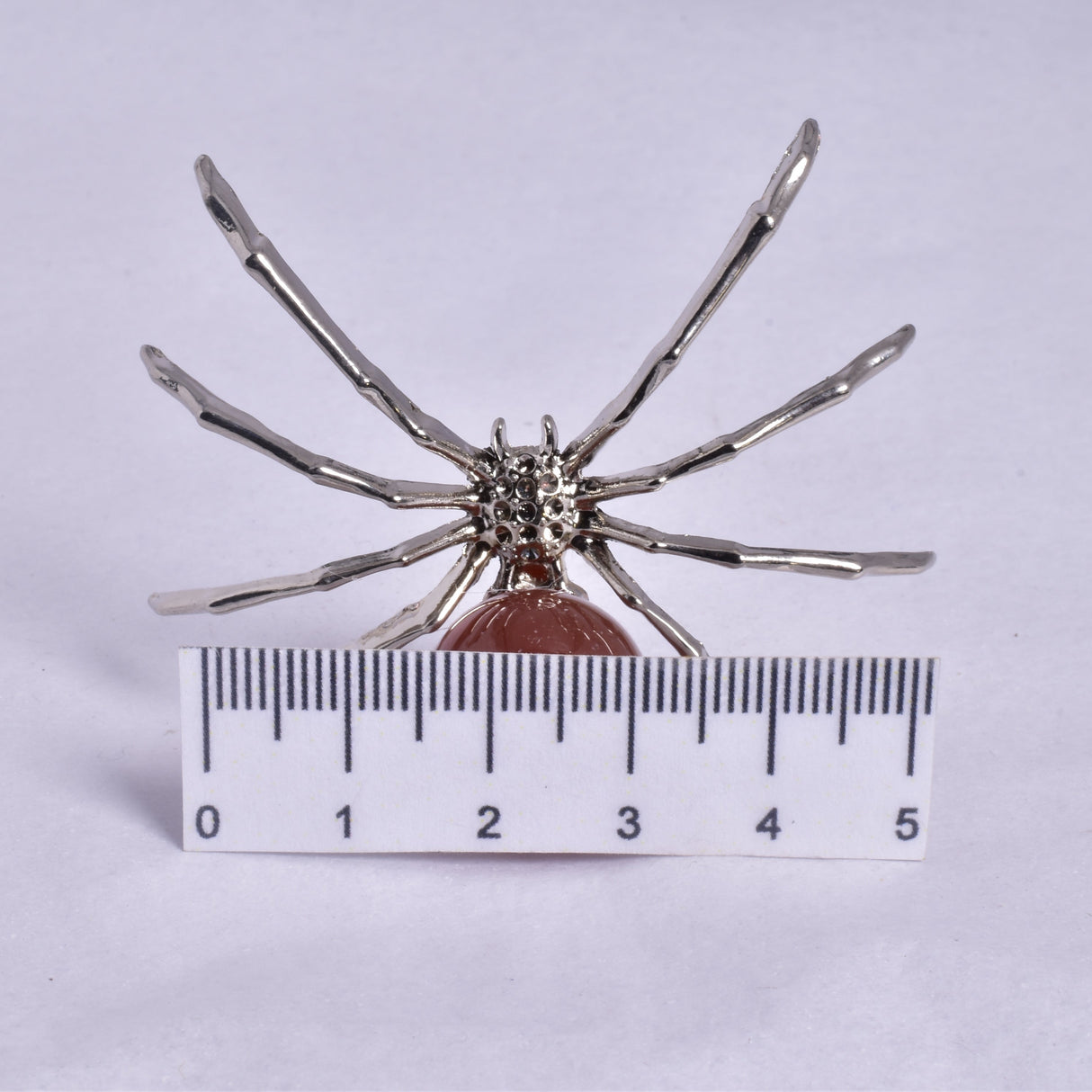 CARNELIAN SPHERE ON METAL SPIDER P369