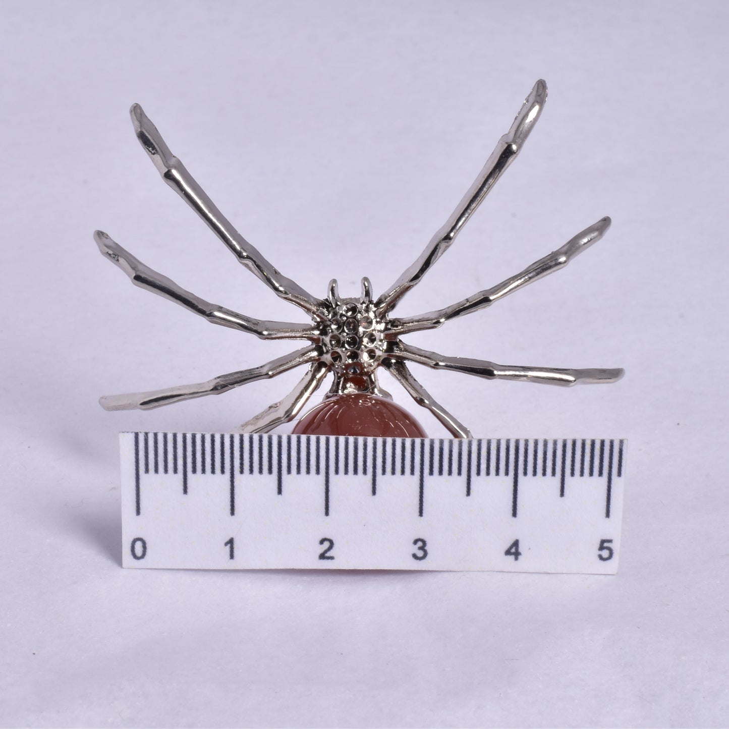 CARNELIAN SPHERE ON METAL SPIDER P369