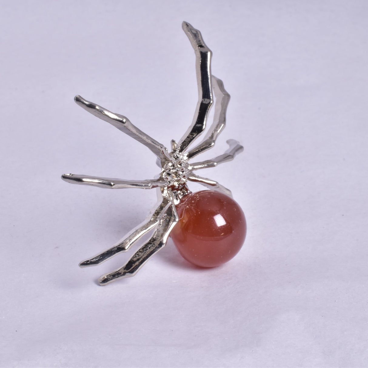 CARNELIAN SPHERE ON METAL SPIDER P369
