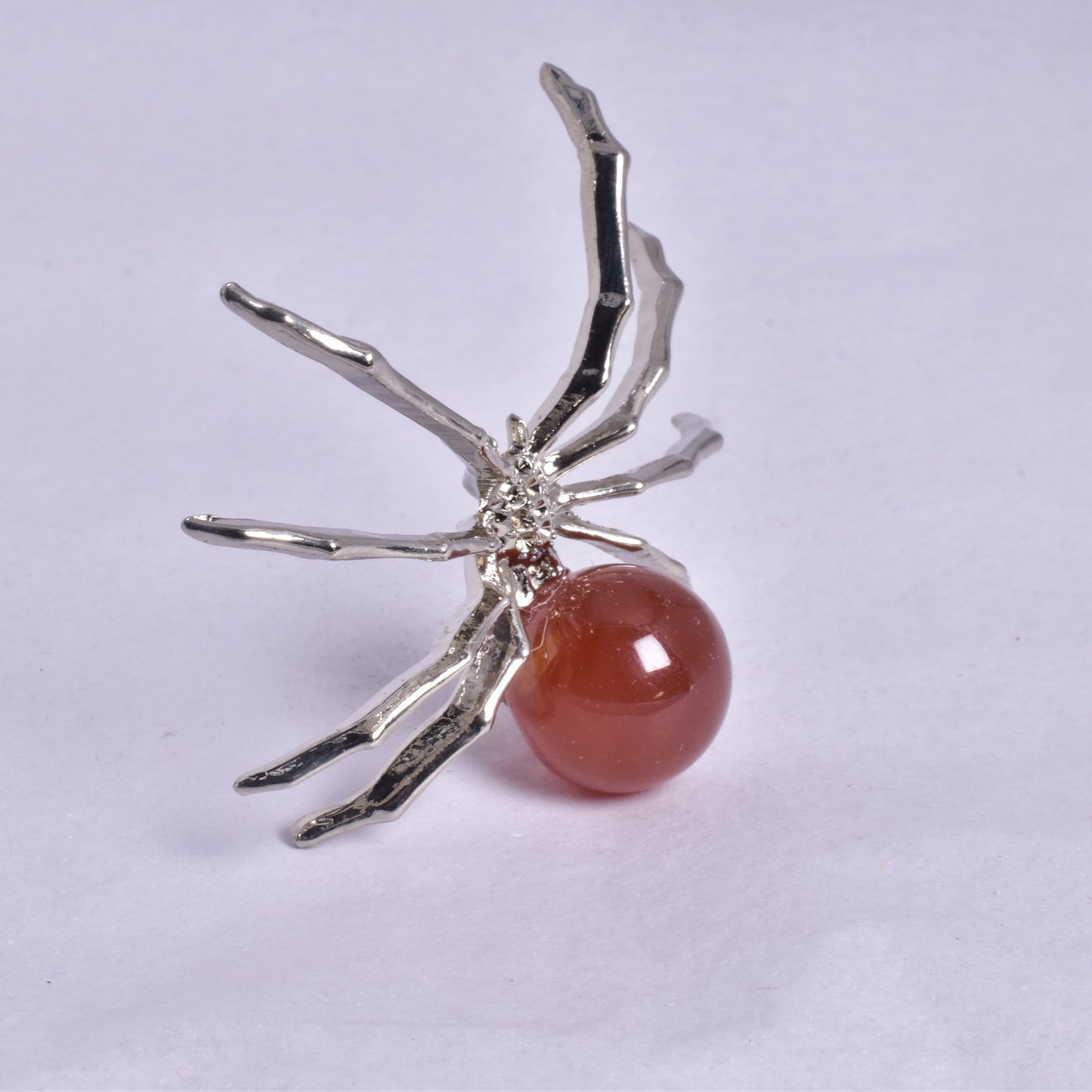 CARNELIAN SPHERE ON METAL SPIDER P369