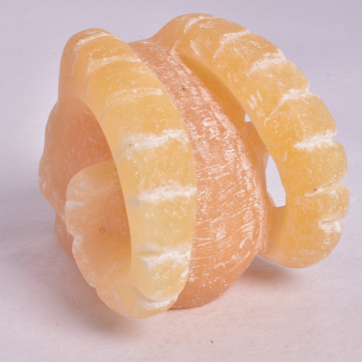 ORANGE CALCITE SKULL WITH RAM HORNS P420